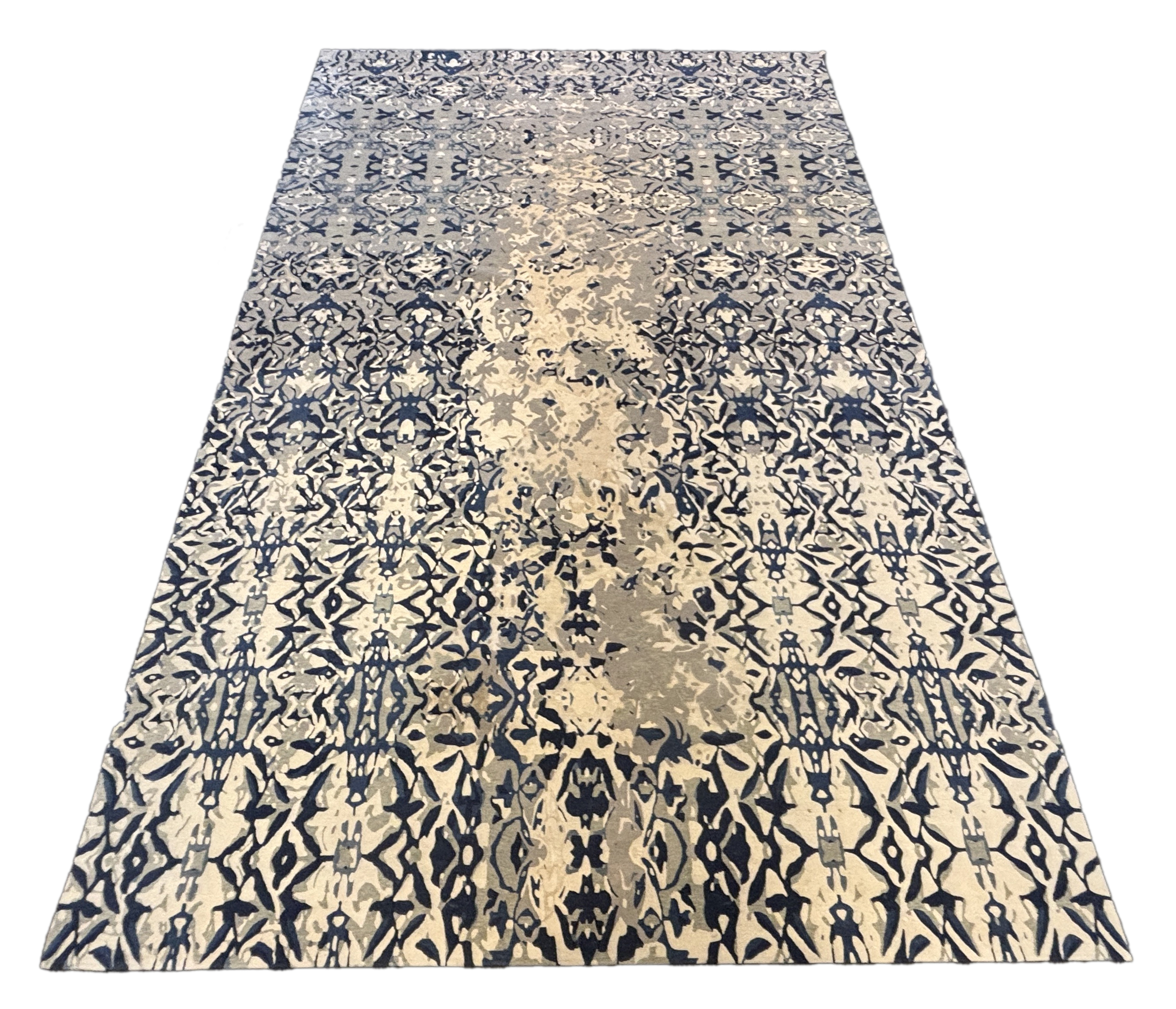 An Elizabeth Ashard 'Moghul', a silk and wool blue tones pattern carpet, 665 x 440cm